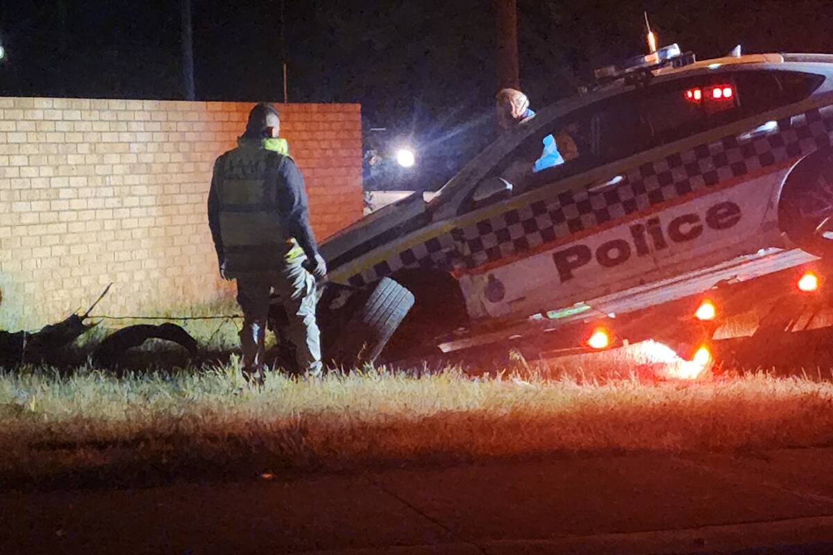 Article image for Police car gets rammed through brick wall of residence